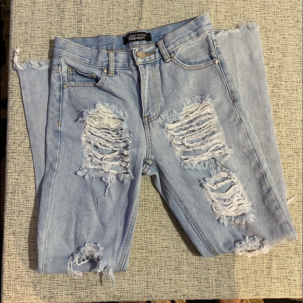 Almost Famous Distresses Light-Washed Jeans.